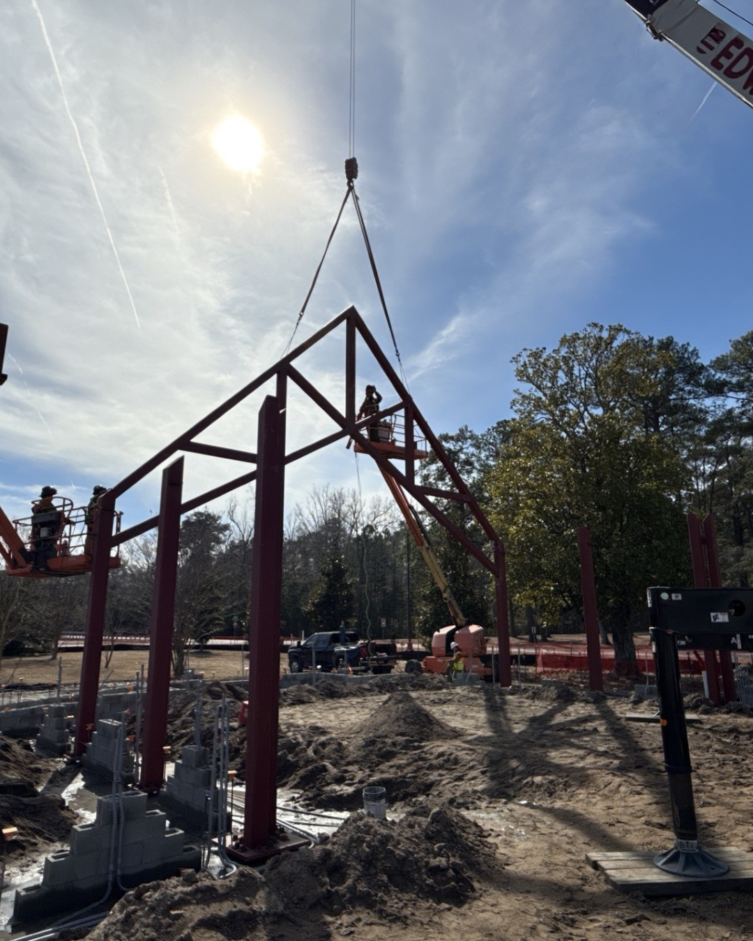 Truss being secured by workers