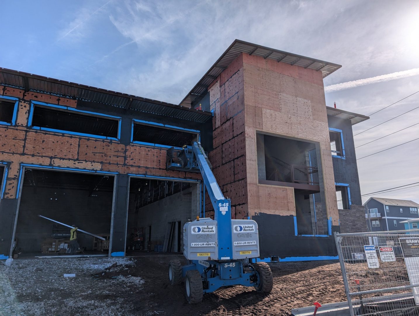 Construction of a new building with heavy equipment in front