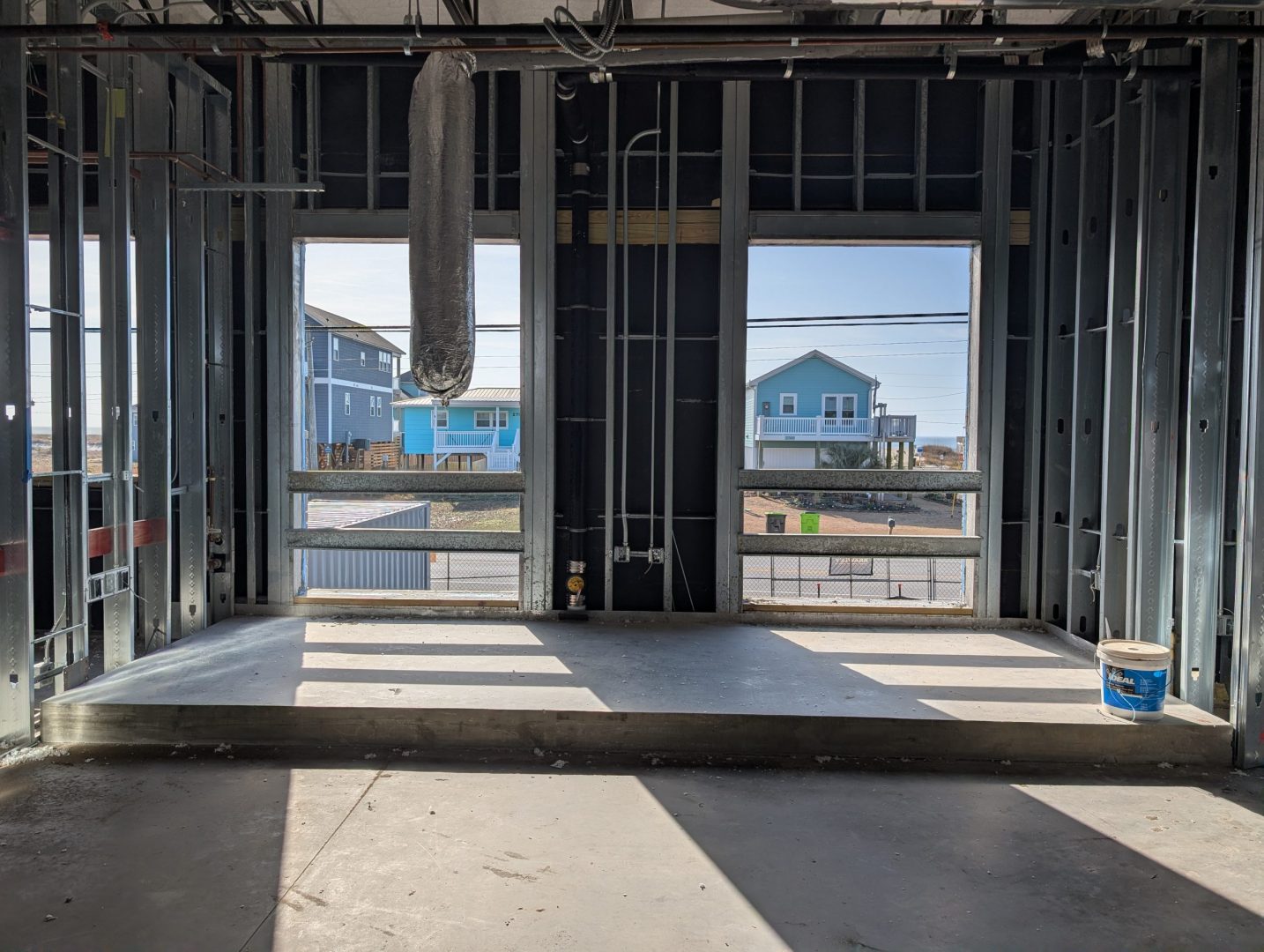 Interior of a room being built before walls and windows are added